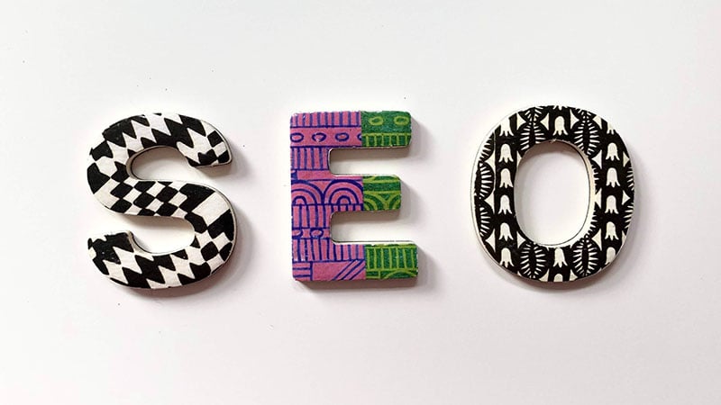 Colorful letters form the acronym SEO.
